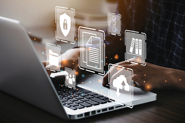 Businessman using a computer to document management concept, online documentation database and digital file storage system/software, records keeping, database technology, file access, doc sharing.