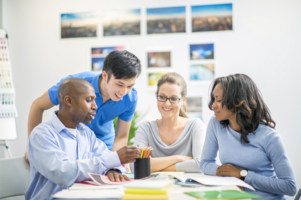Young interns working at the office