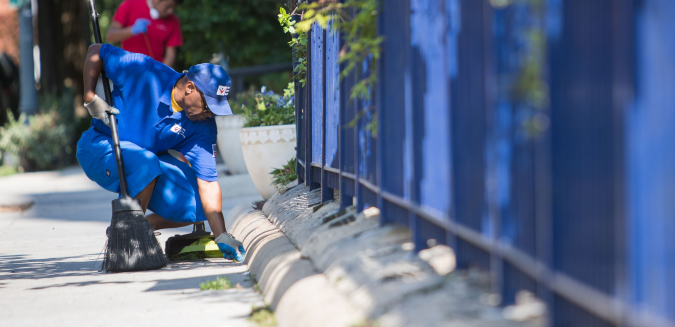 Man pulling weds at a park