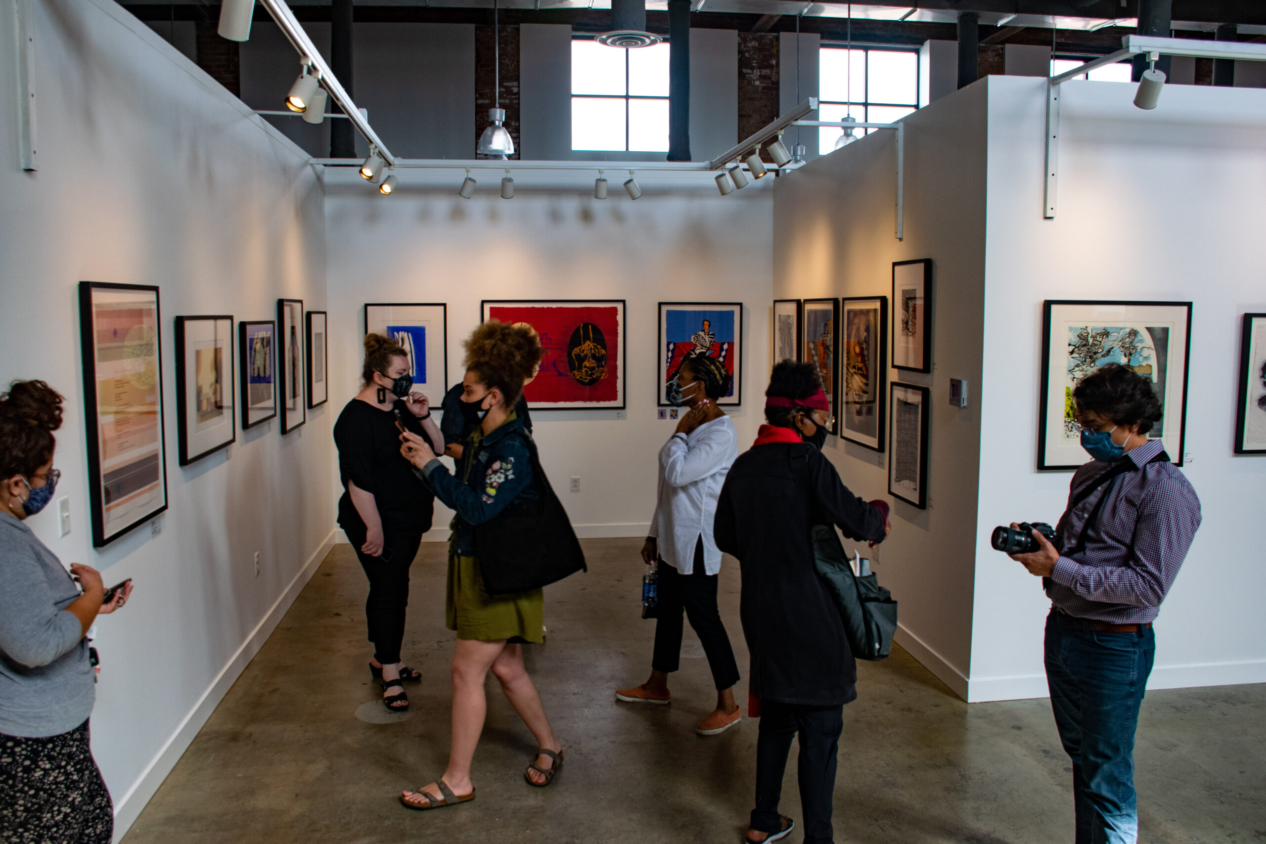 People enjoying art gallery