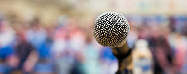 Close up of microphone on a podium in an auditorium